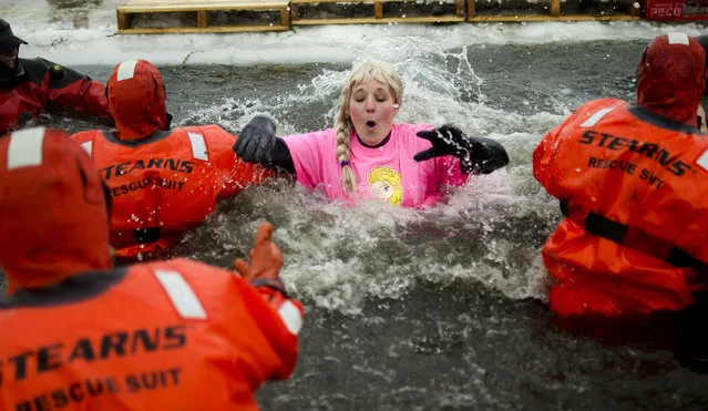 Melissa Courier from team Frozen catches her breath after jumping into the pond at the William H. Haithco Recreation Area during the Michigan Law Enforcement Polar Plunge for Special Olympics, Saturday, February 21, 2015, in Saginaw Township, Mich. (Photo by Andrew Whitaker/AP Photo/The Saginaw News)
