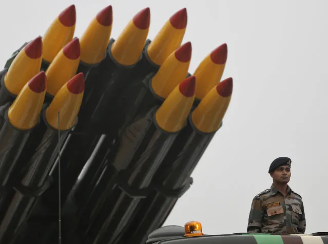 An Indian Army officer stands on a vehicle displaying missiles during the rehearsal for the Republic Day parade in New Delhi, India, January 20, 2016. (Photo by Anindito Mukherjee/Reuters)