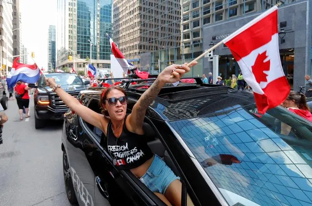 A person protests in support of Dutch farmers, near the Embassy of the Netherlands, in Ottawa, Ontario, Canada on July 23, 2022. (Photo by Patrick Doyle/Reuters)