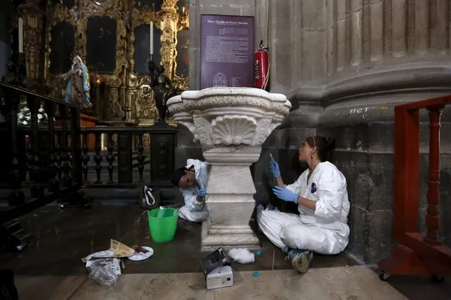Specialists from the National Institute of Anthropology and History (INAH) restore a fountain inside the Metropolitan Cathedral before the visit of Pope Francis in Mexico City, Mexico February 3, 2016. Pope Francis is scheduled to celebrate a mass at the Metropolitan Cathedral when he visits Mexico City. (Photo by Edgard Garrido/Reuters)