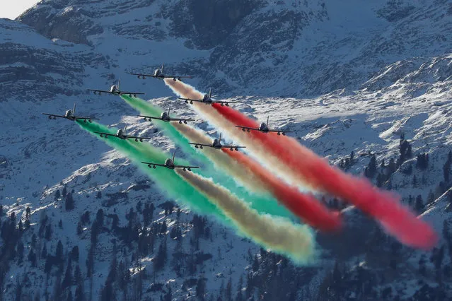 Italian Airforce Frecce Tricolori acrobatic team perform before the start of second run of a men's World Cup Giant Slalom, in Alta Badia, Italy, Sunday, December 16, 2018. (Photo by Stefano Rellandini/Reuters)