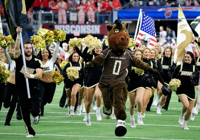 The Western Michigan Broncos cheerleaders and mascot take the field during the 81st Goodyear Cotton Bowl Classic between Western Michigan and Wisconsin at AT&T Stadium on January 2, 2017 in Arlington, Texas. (Photo by Ron Jenkins/Getty Images)