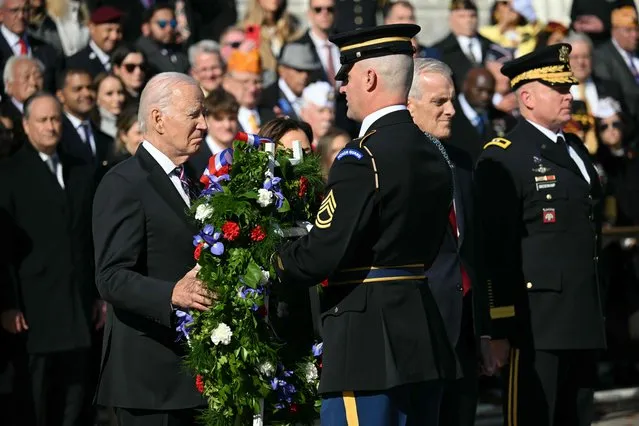 US President Joe Biden lays a wreath at the Tomb of the Unknown Soldier in Arlington National Cemetery during celebrations for Veterans Day, on November 11, 2023, in Arlington, Virginia. (Photo by Mandel Ngan/AFP Photo)