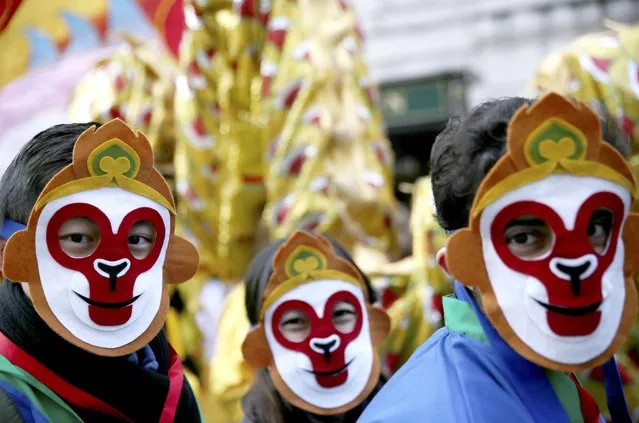 Performers wearing masks attend an event to celebrate Chinese New Year, in London, Britain February 14, 2016. The celebrations on Sunday marked the Chinese New Year of the Monkey, which fell on February 8, 2016. (Photo by Neil Hall/Reuters)
