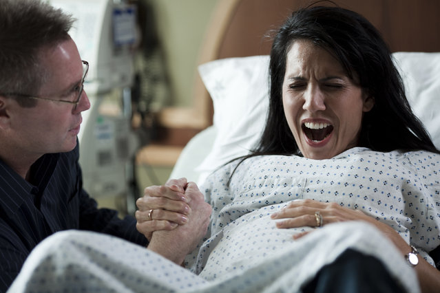 Man assisting childbirth in hospital in Utah, USA. (Photo by RubberBall Productions/Getty Images)
