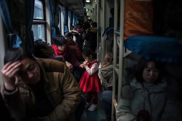 Chinese passengers travel on a train heading out of Beijing, China, 01 February 2019. Nearly 3 billion trips are expected to be made during China's annual Spring Festival this year. Millions of Chinese travel back to their hometowns to celebrate the Lunar New Year, or Spring Festival, with their families. (Photo by Roman Pilipey/EPA/EFE)