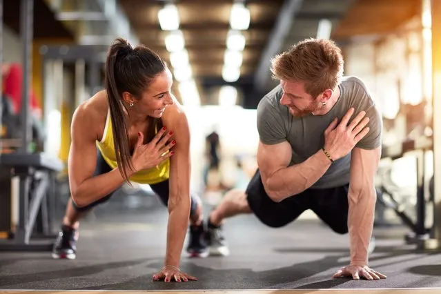 Man and woman strengthen hands at fitness training. (Photo by Lucky Business/Getty Images)