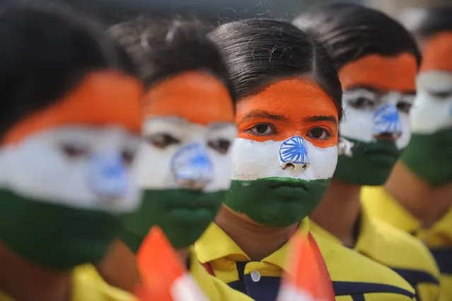 Indian school students wearing facepaint depicting the national flag take part in an event to mark Republic Day in Chennai on January 25, 2017. The Crown Prince of Abu Dhabi Sheikh Mohamed bin Zayed Al Nahyan will be the chief guest of honour at India's forthcoming 68th Republic Day celebrations on January 26. (Photo by Arun Sankar/AFP Photo)