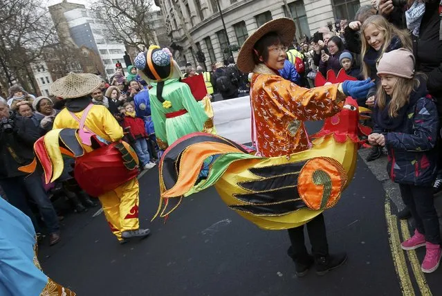 A woman in a rooster costume takes part in an event to celebrate the Chinese Lunar New Year of the Rooster in London, Britain, January 29, 2017. (Photo by Neil Hall/Reuters)