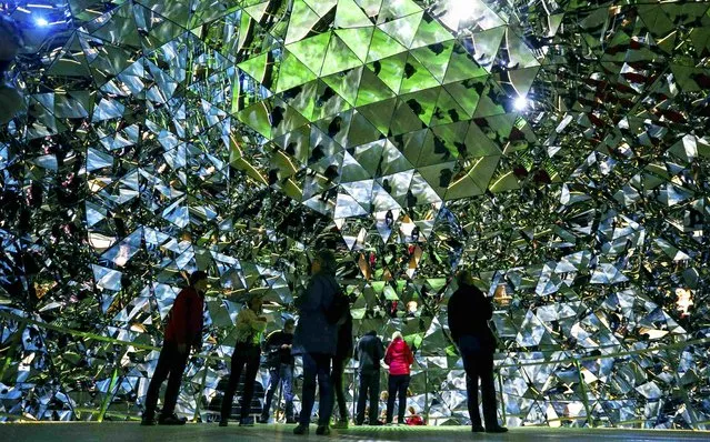 Visitors walk through the Swarowski Crystal World museum on its reopening day following renovation, in the western Austrian village of Wattens April 30, 2015. (Photo by Dominic Ebenbichler/Reuters)