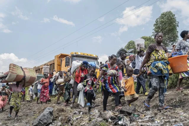 Thousands who are fleeing the ongoing conflict between government forces and M-23 rebels reach the entrance the Democratic Republic of Congo eastern city of Goma Wednesday, February 7, 2024. (Photo by Moses Sawasawa/AP Photo)
