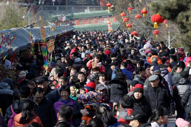 People crowd for a temple fair at Badachu park as the Chinese Lunar New Year, which welcomes the Year of the Rooster, is celebrated in Beijing, China, January 31, 2017. (Photo by Jason Lee/Reuters)