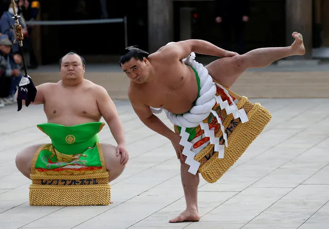 Mongolian-born grand sumo champion Yokozuna Harumafuji (R) performs the New Year's ring-entering rite at the annual celebration for the New Year at Meiji Shrine in Tokyo, Japan January 6, 2017. (Photo by Issei Kato/Reuters)
