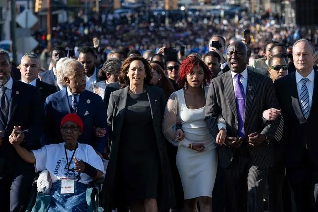 US Vice President Kamala Harris (2nd L), Second Gentleman Doug Emhoff (R), Civil rights attorney Ben Crump (2nd R) and the Reverend Al Sharpton (2nd L) join a march across the Edmund Pettus Bridge during a commemoration of the 59th anniversary of Bloody Sunday in Selma, Alabama, March 3, 2024. On March 7, 1965, civil rights marchers crossed the Edmund Pettus Bridge and clashed with state police who used batons and tear gas to disperse the protesters. (Photo by Saul Loeb/AFP Photo)