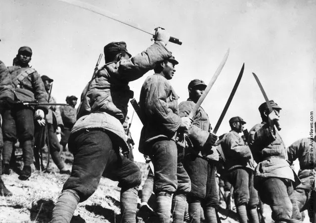 1933: In padded uniforms, Chinese 'Big Sword' troops wielding their weapons during the fighting to defend Jehol in the Sino-Chinese war