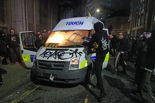 Protesters set fire to a vandalised police van outside Bridewell Police Station, demonstrating against the Government's controversial Police and Crime Bill on Sunday March 21, 2021. (Photo by Andrew Matthews/PA Images via Getty Images)