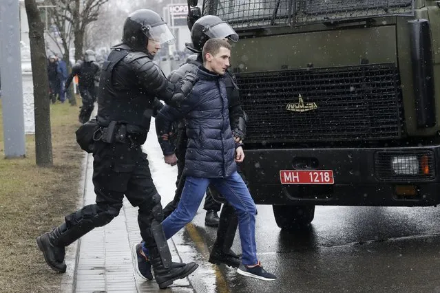 Belarus police detain an activist during an opposition rally in Minsk, Belarus, Saturday, March 25, 2017. (Photo by Sergei Grits/AP Photo)