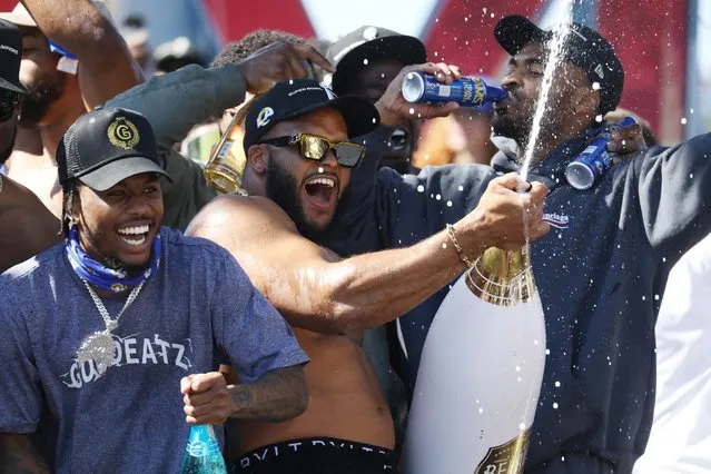 Aaron Donald celebrates with teammates at the LA Rams' Super Bowl parade at Memorial Coliseum in Los Angeles, California, U.S. February 16, 2022. (Photo by David Swanson/Reuters)