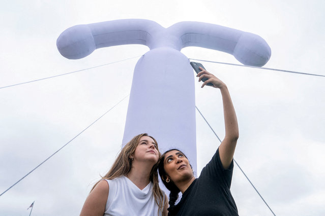 Hannah Tuohy  and Meghan Ravi, both with Americans for Contraception, take a selfie in front of an Inflatable contraceptive implant Intra Uterine Device (IUD) on Capitol Hill ahead of a Senate vote on the “Right to Contraception Act”, Washington on June 5, 2024. (Photo by Nathan Howard/Reuters)