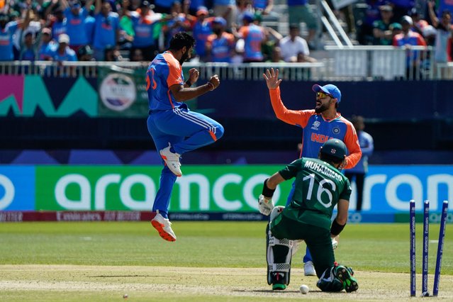India's Jasprit Bumrah (L) celebrates after dismissing Pakistan's Mohammad Rizwan during the ICC men's Twenty20 World Cup 2024 group A cricket match between India and Pakistan at Nassau County International Cricket Stadium in East Meadow, New York on June 9, 2024. (Photo by Timothy A. Clary/AFP Photo)