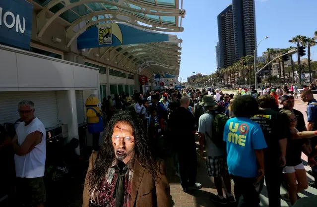 A zombie character walks outside along the Convention Center during the 2015 Comic-Con International in San Diego, California July 10, 2015. (Photo by Sandy Huffaker/Reuters)