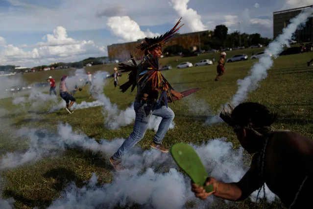 Brazilian Indians take part in a demonstration against the violation of indigenous people's rights, in Brasilia, Brazil April 25, 2017. (Photo by Ueslei Marcelino/Reuters)