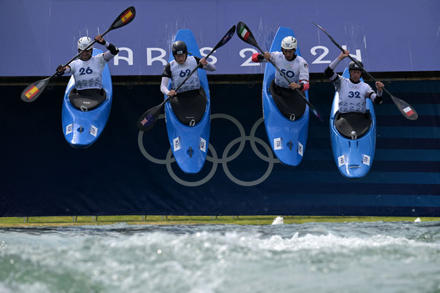 Athletes practice canoe slalom at the Vaires-sur-Marne Nautical Stadium in Vaires-sur-Marne July 24, 2024, ahead of the Paris 2024 Olympic Games. (Photo by Bertrand Guay/AFP Photo)