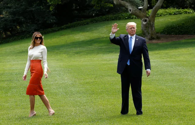 Melania Trump looks back as U.S. President Donald Trump waves upon his departure from the White House to embark on his trip to the Middle East and Europe, in Washington, U.S., May 19, 2017. (Photo by Kevin Lamarque/Reuters)
