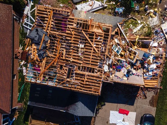 In an aerial view,  a heavily damaged home is seen in the Glenmary subdivision on April 14, 2022 in Louisville, Kentucky. Louisville's Mayor Greg Fischer declared a state of emergency in the city and Jefferson County Public Schools cancelled classes in response to the storm damage. (Photo by Jon Cherry/Getty Images)