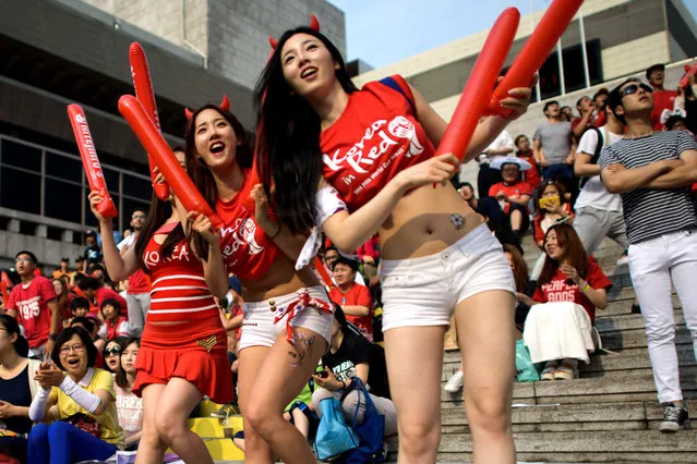 South Korean football fans react during a public screening in Seoul of the South Korea vs Russia football match at the 2014 World Cup in Brazil, early on June 18, 2014. (Photo by Ed Jones/AFP Photo)