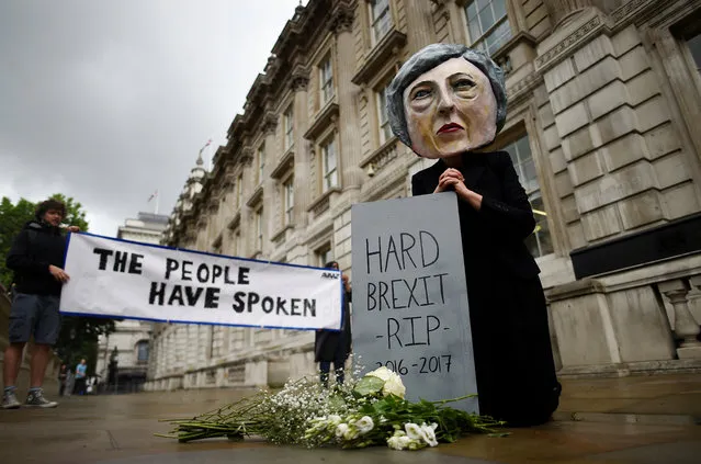 Protestor wearing a Theresa May mask is seen the day after Britain's election in London, Britain June 9, 2017. (Photo by Clodagh Kilcoyne/Reuters)
