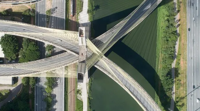 An aerial view of empty Octavio Frias de Oliveira bridge, a cable-stayed bridge, on the first day of lockdown imposed by the state government because of coronavirus in Sao Paulo, Brazil, March 24, 2020. (Photo by Leonardo Benassatto/Reuters)