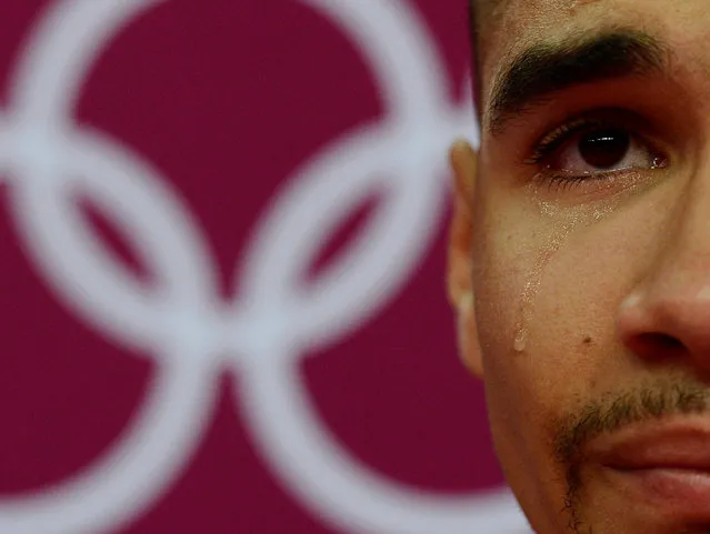 Louis Smith of Great Britain cries during the men's gymnastics qualification in the North Greenwich Arena during the London 2012 Olympic Games in Britain July 28, 2012. Dylan Martinez: “During the long build up to the London Olympics all eyes were on a few of the gold medal hopes – I remember the pressure on them growing as we got closer to the opening ceremony. The British gymnastics team had a few high profile members but none more so than pummel star Louis Smith. I had photographed him at past championships and was always impressed by his focus. (Photo by Dylan Martinez/Reuters)