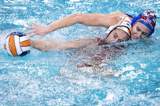 Spain's Paula Camus Amoros (L) fights for the ball with Croatia's Kiara Brnetic during the quarter-final European Water Polo Championship women's match between Spain and Croatia at the Pieter van den Hoogenband Swimming Stadium in Eindhoven, on January 9, 2024. (Photo by Sander Koning/ANP via AFP Photo)