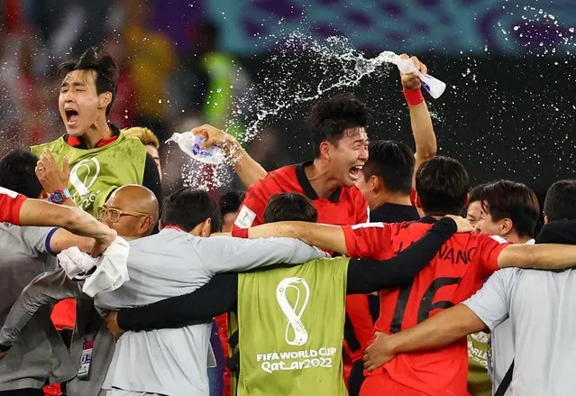 Players of Korea Republic celebrating the victory during the World Cup match between Korea Republic v Portugal at the Education City Stadium on December 2, 2022 in Al Rayyan, Qatar. (Photo by Kai Pfaffenbach/Reuters)