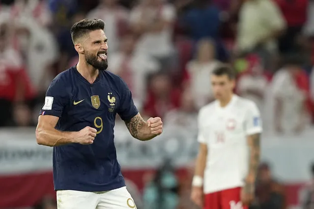 France's Olivier Giroud celebrates scoring his side's first goal during the World Cup round of 16 soccer match between France and Poland, at the Al Thumama Stadium in Doha, Qatar, Sunday, December 4, 2022. (Photo by Martin Meissner/AP Photo)