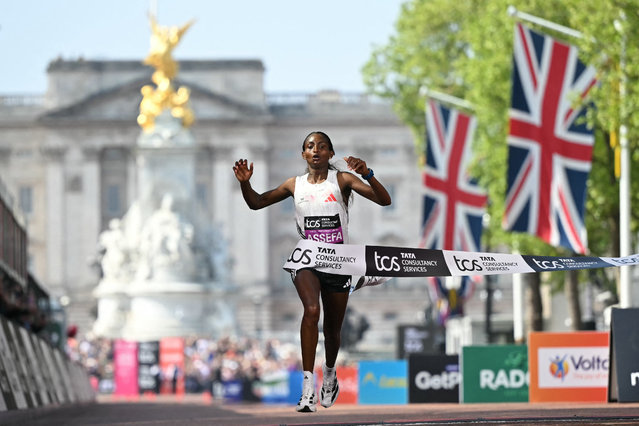 Ethiopia's Tigst Assefa crosses the line to win the women's race at the 2025 London Marathon in central London on April 27, 2025. (Photo by Justin Tallis/AFP Photo)