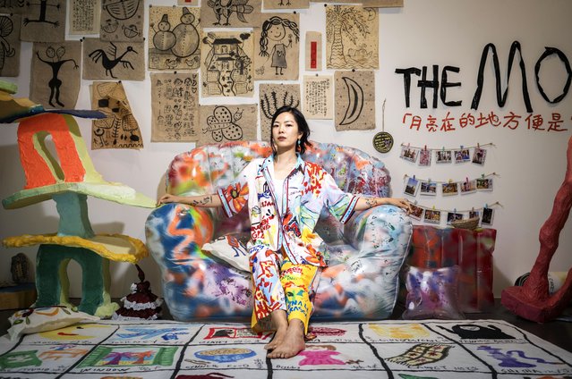 Artist Mowen Li (Amira) with her work in the Unstable Grounds exhibition by New York University Abu Dhabi Master of Fine Arts graduates, at 421 Arts Campus on May 29, 2025. (Photo by Antonie Robertson/The National)
