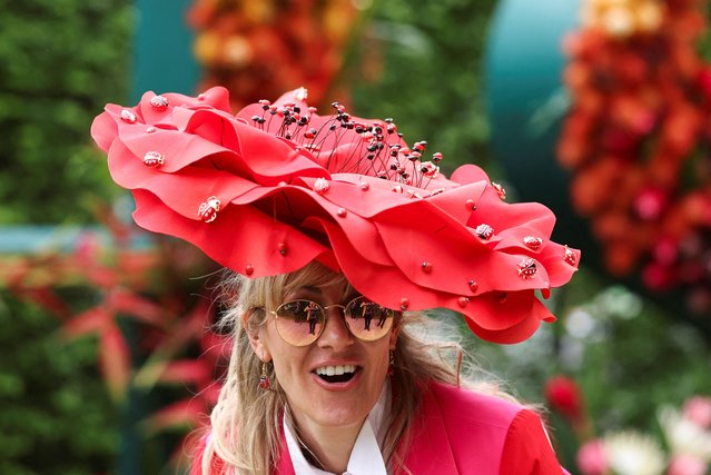 Laura Konig, wearing a floral headwear, visits the Chelsea Flower Show in London, Britain, on May 19, 2025. (Photo by Toby Melville/Reuters)