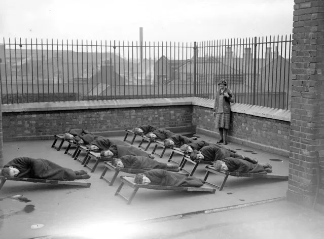 Children sleeping on the roof of a school, for orphans, 20s. (Photo by Fox Photos/Getty Images)