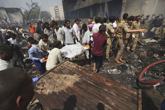 Rescuers work at the site of an airplane that crashed in India's northwestern city of Ahmedabad in Gujarat state, Thursday, June 12, 2025. (Photo by Ajit Solanki/AP Photo)