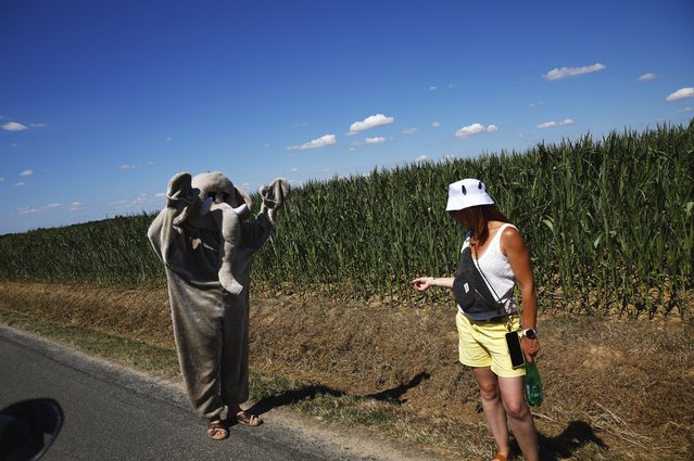 A man dressed as an elephant waits the peloton during the 8th stage of the Tour de France cycling race over 171.4km from Saint-Meen-le-Grand to Laval Espace Mayenne, France, 12 July 2025. (Photo by Martin Divíšek/EPA)