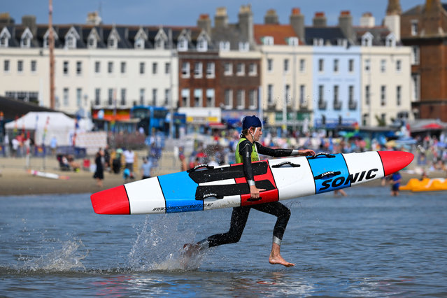 Competitors take part in the Junior category of The SLSGB National Surf Life Saving Championships on Weymouth beach, on August 06, 2025 in Weymouth, England. The SLSGB (Surf Life Saving Great Britain) National Surf Life Saving Championships 2025 are being held from August 2-9 on Weymouth beach with athletes of all ages competing in a wide range of lifesaving races designed to test their speed, strength, and water rescue skills. (Photo by Finnbarr Webster/Getty Images)
