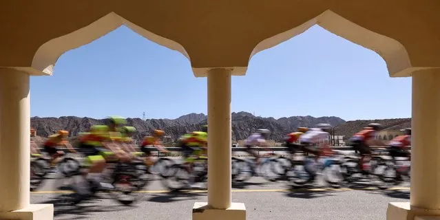The pack rides during the third stage of the Tour of Oman 2023, from al-Khobar to Jabal Haat, on February 13, 2023. (Photo by Thomas Samson/AFP Photo)