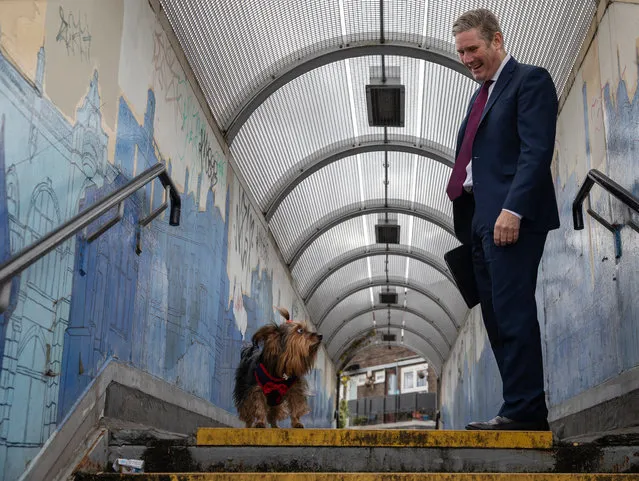 Labour leader Keir Starmer speaks to a member of the public (not pictured) after bumping into her dog, Lucy the terrier, on a footbridge after a surgery visit on October 06, 2020 in London, England. Mr Starmer visited “The Project Surgery” in Newham to speak to staff about their experiences during the Covid-19 pandemic. (Photo by Dan Kitwood/Getty Images)