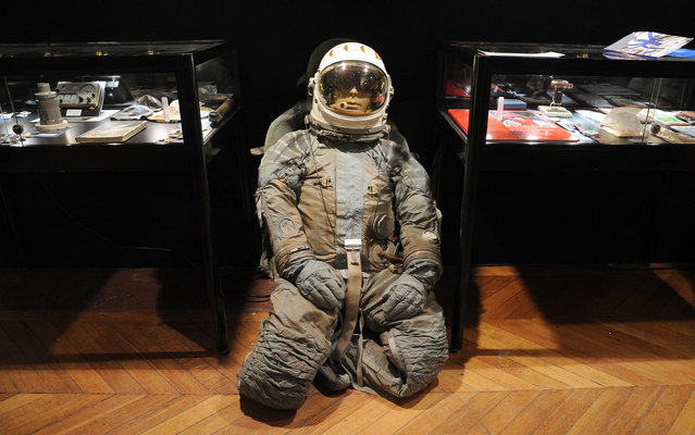 This picture shows a cosmonaut suit among other sovietic space program items on display at the Cornette de Saint Cyr auction house on March 25, 2013 in Paris. (Photo by Pierre Andrieu/AFP Photo)