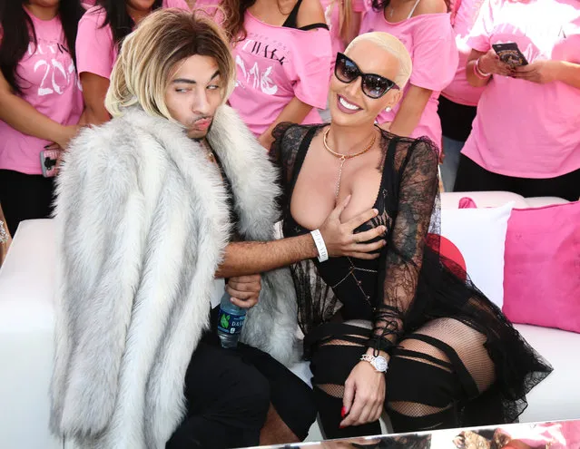 Amber Rose gets her boob grabbed by Joanne the Scammer at the Amber Rose Slutwalk in Los Angeles, CA on October 2, 2016. (Photo by London Entertainment/Splash News)