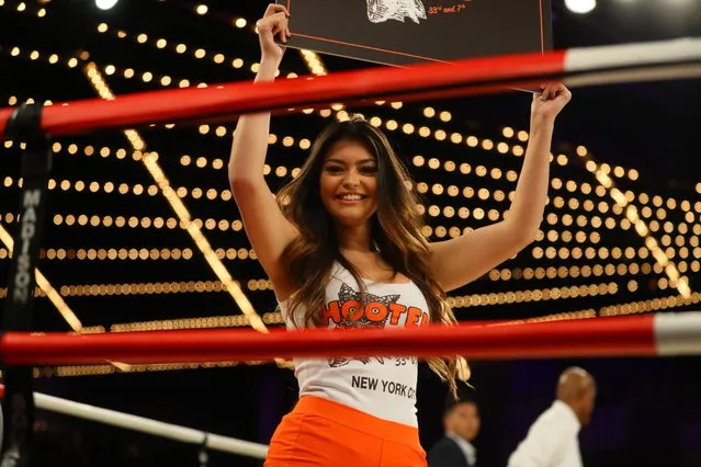 A card girl from Hooters holds ring card in the match between Brian Fielder and Brian Huang in the NYPD Boxing Championships at the Hulu Theater at Madison Square Garden on March 15, 2018. (Photo by Gordon Donovan/Yahoo News)
