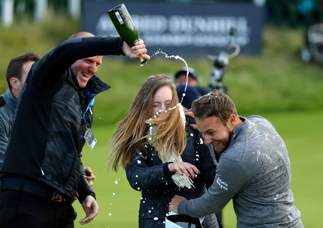 Tyrrell Hatton of England celebrates on the 18th green after winning the Alfred Dunhill Links Championship at The Old Course on October 9, 2016 in St Andrews, Scotland. (Photo by Richard Heathcote/Getty Images)