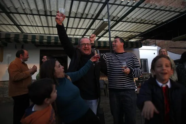 Winners of Spain's Christmas Lottery “El Gordo” celebrate in Arriate, near Malaga, southern Spain December 22, 2014. (Photo by Jon Nazca/Reuters)